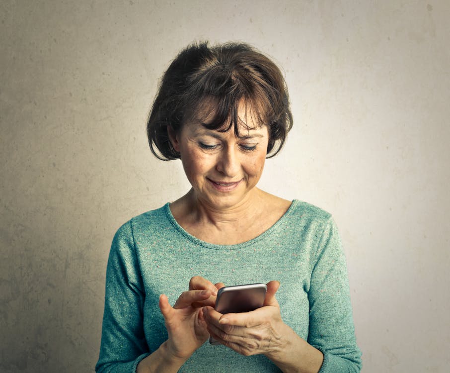 Person holding a handheld digital device