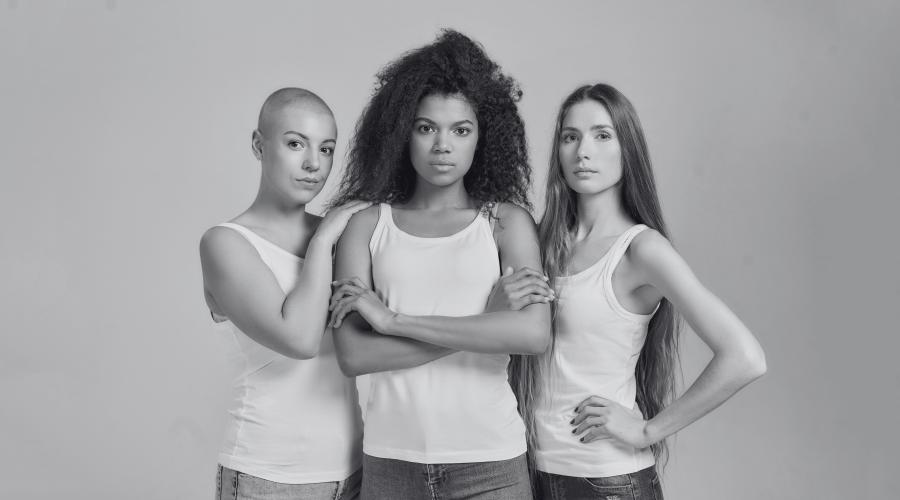 three women looking straight ahead