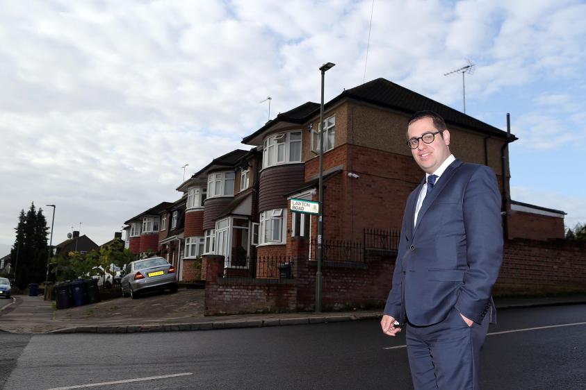 Councillor Dean Cohen, Chair of the Environment Committee, stands beneath one of the new LED lanterns.