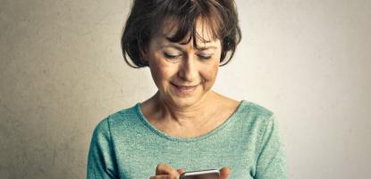 Person holding a handheld digital device